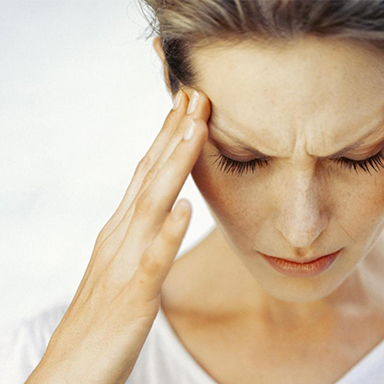 Lady with Headache, Migraine, Chiropractor Belfast